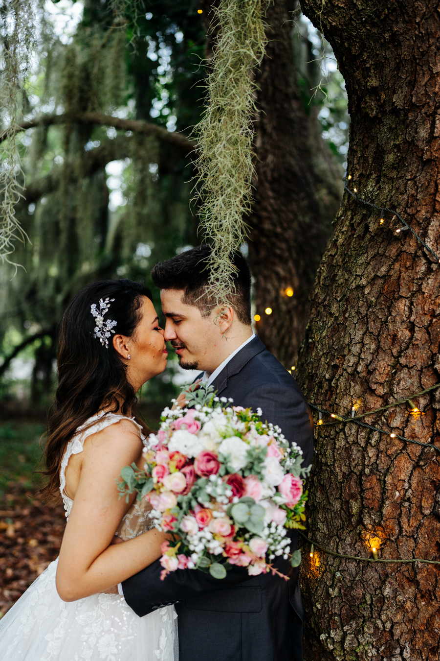 Romantic picture of groom and bride under a tree at Ever After Farms Ranch